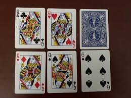 Beginner-friendly Golf card game setup with players and cards arranged on a table