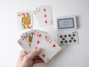 Players engaging in an online multiplayer War card game on a digital platform.